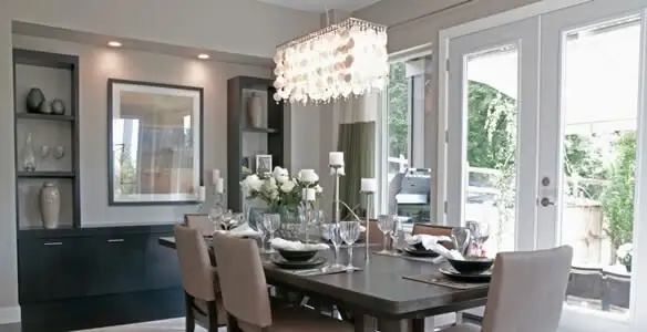 Elegant dining room chandelier installation above table in Harrisburg, PA