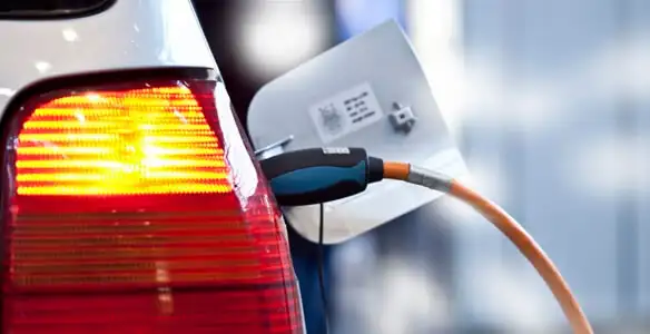 Electric car plugged into EV charger after professional installation in Harrisburg, PA