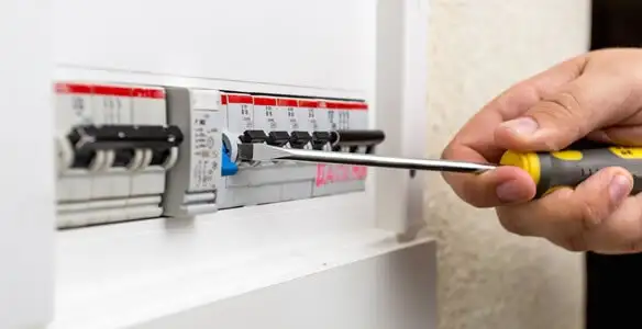 electrical panel upgrade service showing technician adjusting circuit breakers during system upgrade in Harrisburg, PA