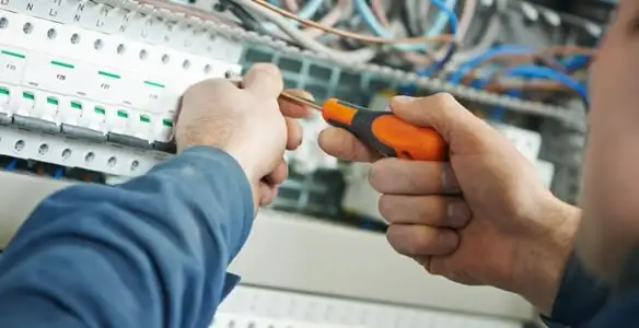 electrical service showing licensed electrician performing electrical panel maintenance and adjustments in Harrisburg, PA
