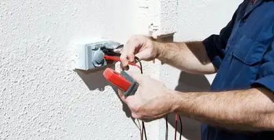 Electrician performing home electrical outlet and wiring inspection in Harrisburg, PA