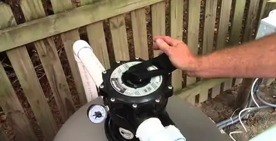 pool pumps service showing professional adjustment of pool pump control system in Harrisburg, PA