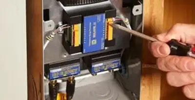 Whole home surge protection device being installed by a licensed electrician to protect electrical systems in Harrisburg, PA